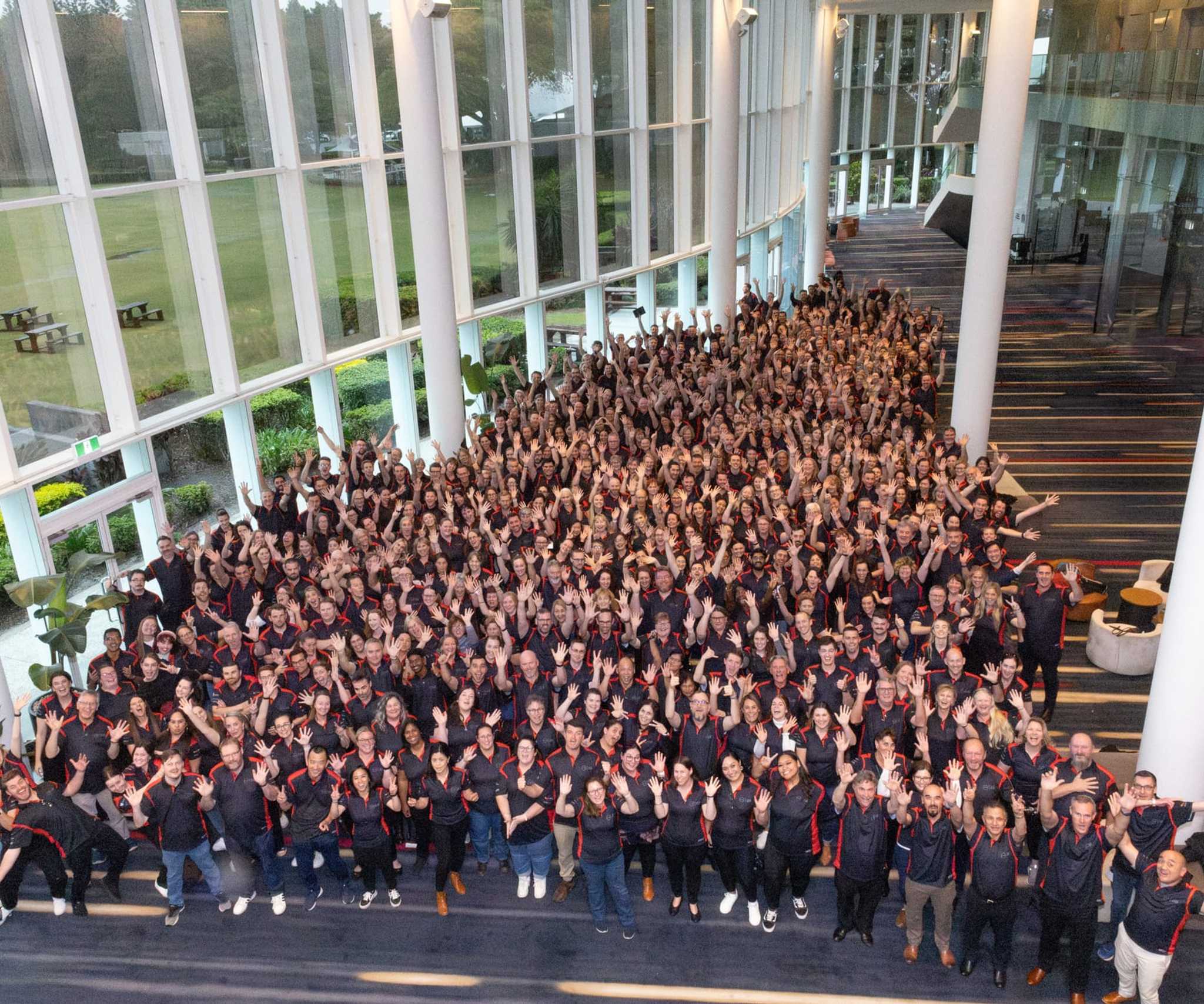 large group of CEM employees at conference taking group photo